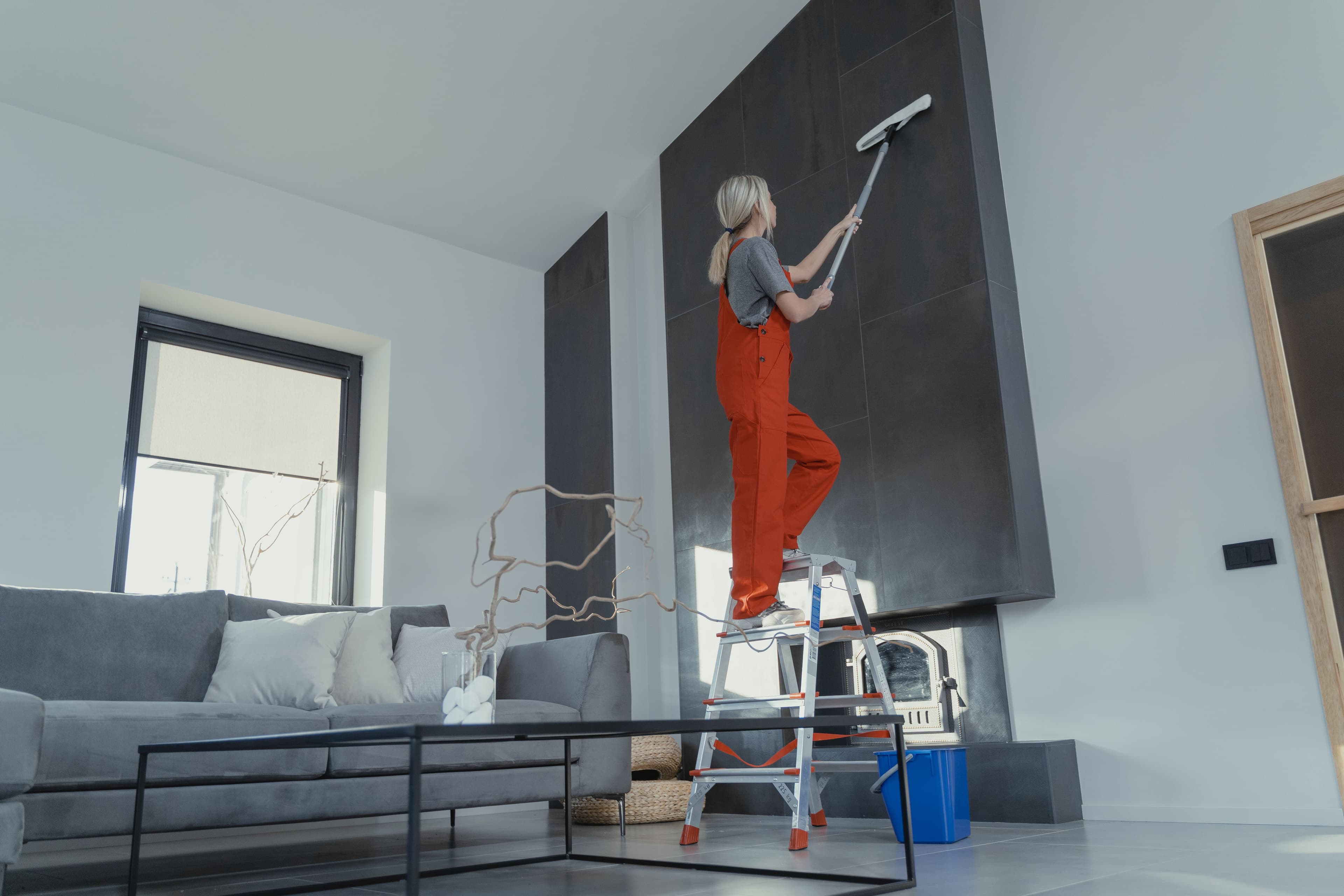 GreenCare janitorial technician cleaning a modern commercial office